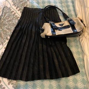Black leather and lace pleated skirt